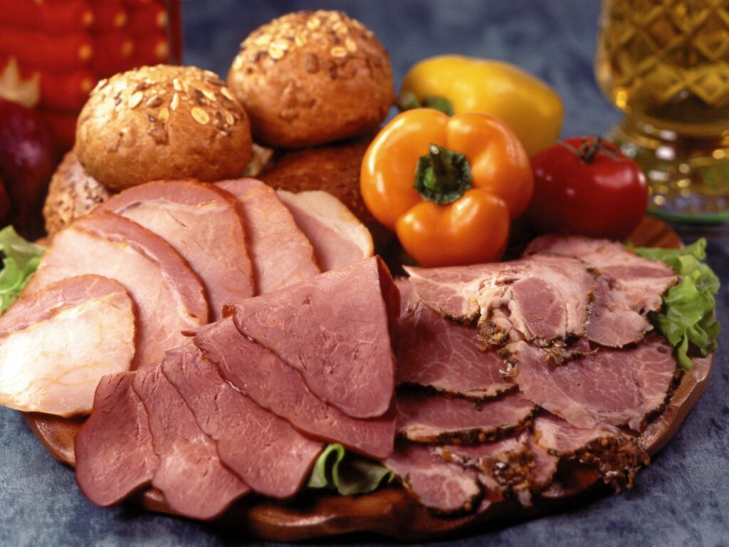 Delicious Meat and Veggie Spread on Wooden Platter - Wallpaper