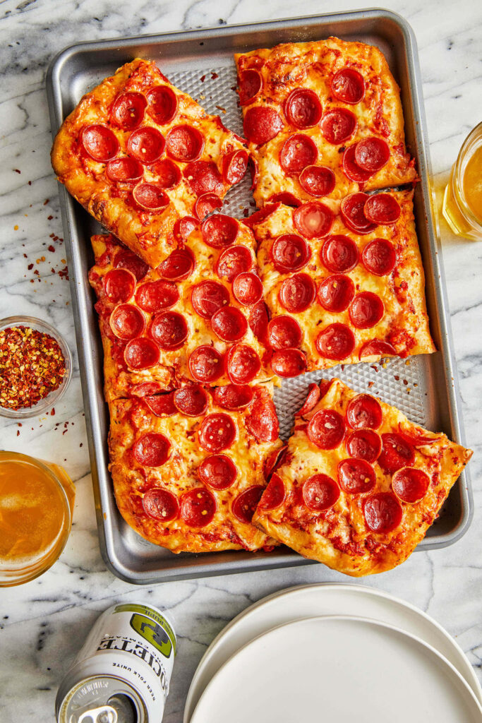 Delicious Square Pepperoni Pizza Wallpaper with Cheese & Chili Flakes