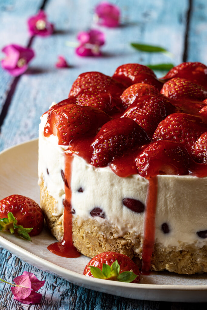 Decadent Strawberry Cheesecake Wallpaper on Rustic Blue Background