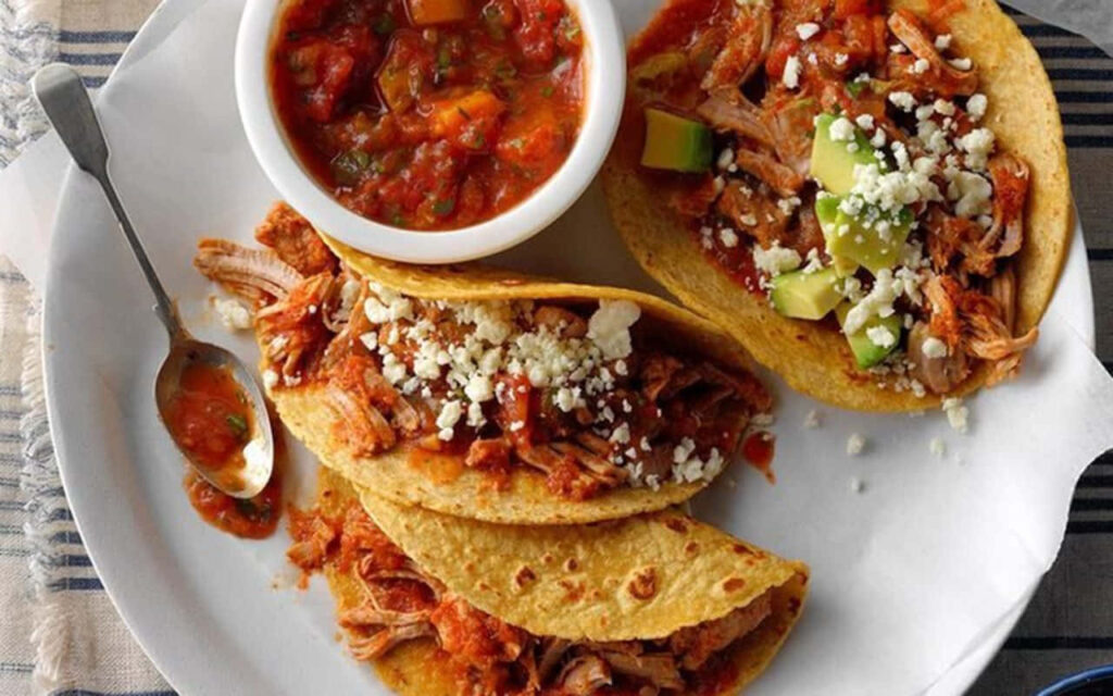 Delicious Taco Wallpaper: Shredded Meat, Cheese & Avocado Delight