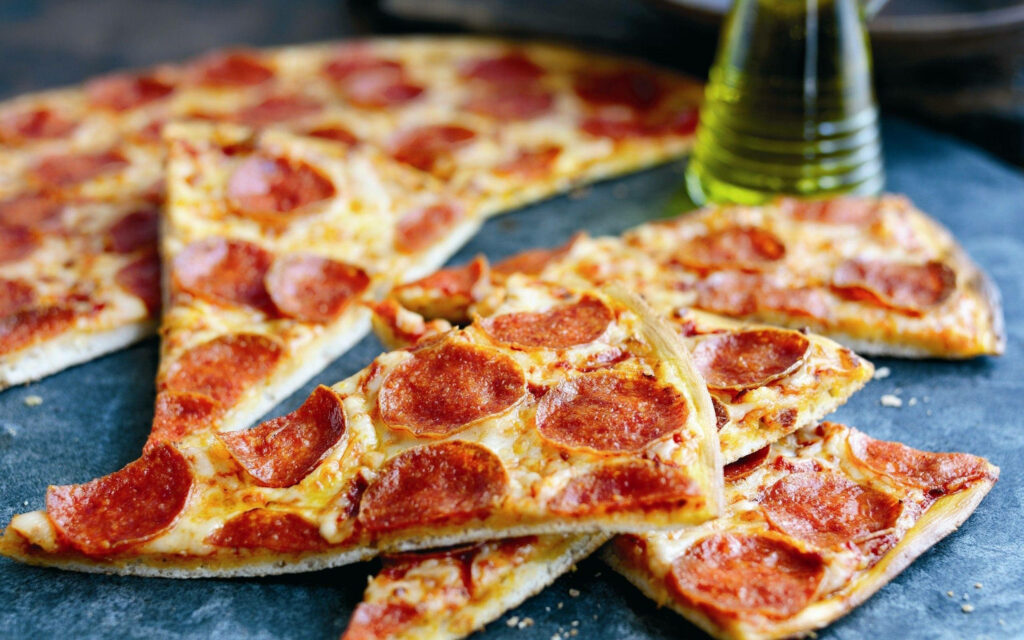 Thin-crust Detroit pepperoni pizza with melted cheese on dark background fresh savory wallpaper