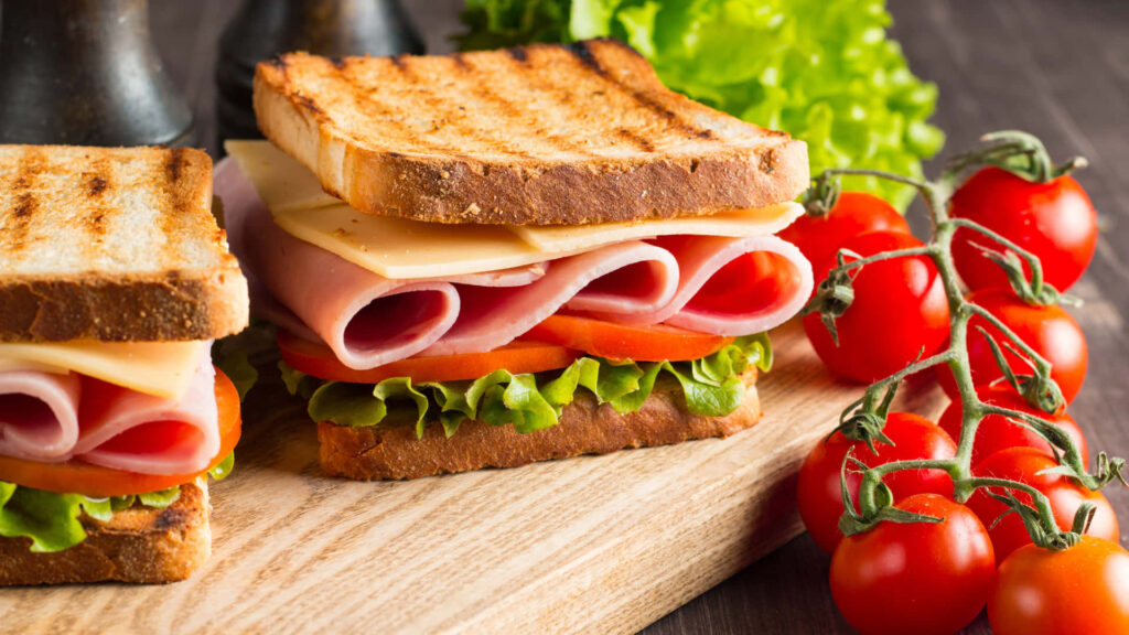 Toasted Sandwich Delight with Lettuce, Ham, and Cheese Wallpaper