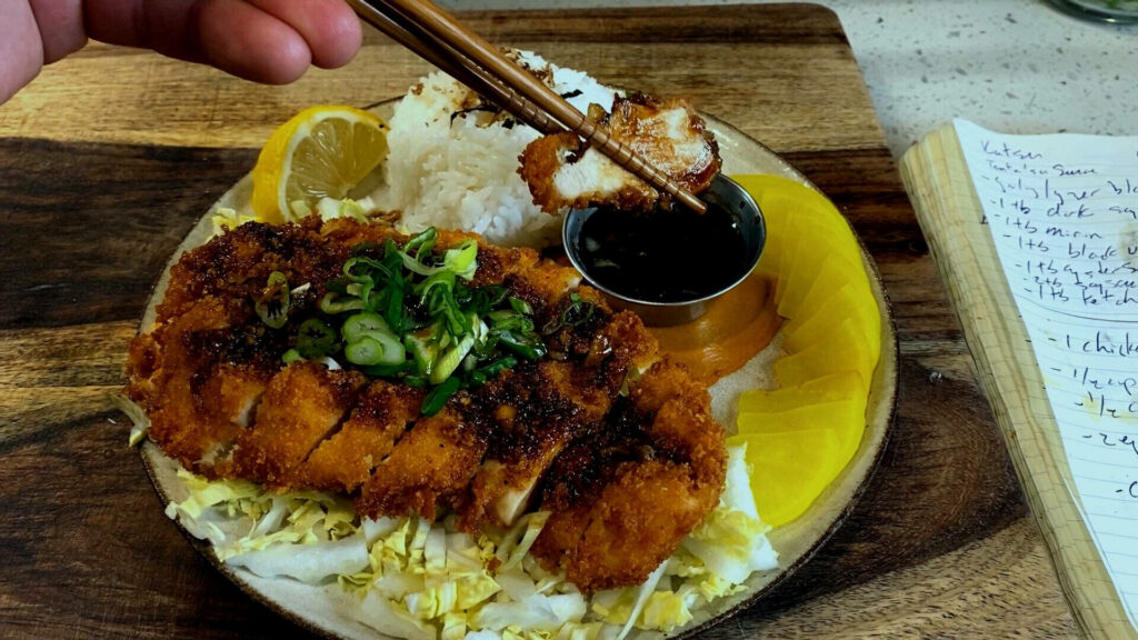 Close-Up Tonkatsu Delight: Crispy Pork Cutlet with Rice & Veggies Wallpaper