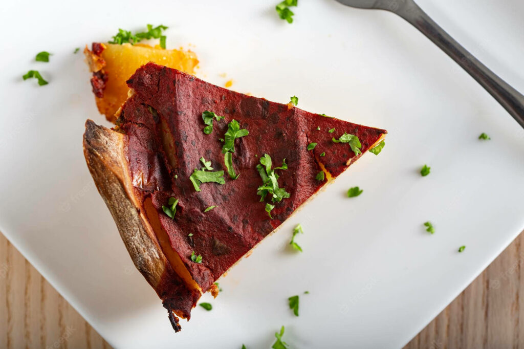 Delicious Moussaka Slice on White Plate - Top View Wallpaper