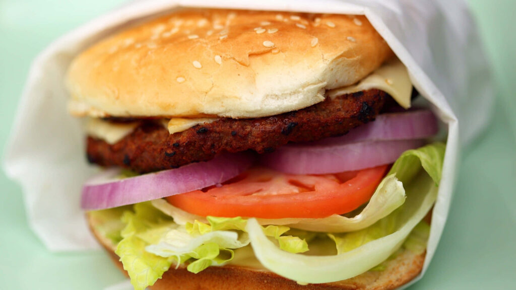 Close-Up Veggie Burger: Sesame Bun, Fresh Veggies & Grilled Perfection Wallpaper