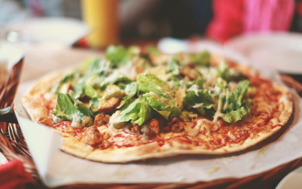 Delicious Vegetable Pizza on Crispy Crust - Wallpaper Background