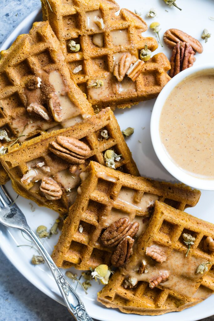Delicious Waffles with Nuts & Creamy Sauce - Dessert Wallpaper