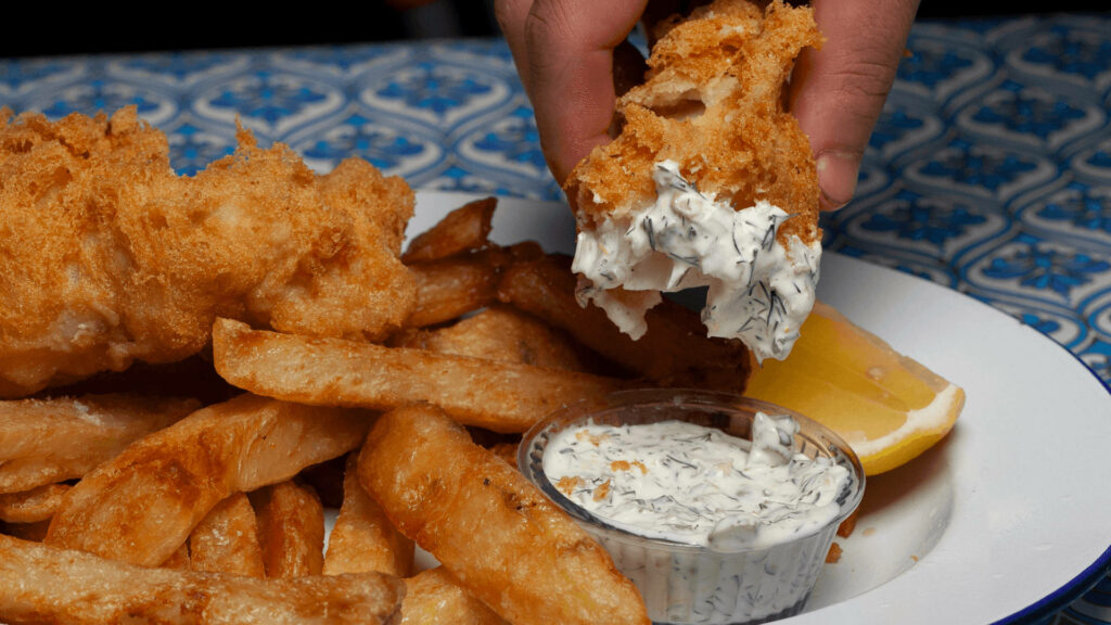 Appetizing Fish and Chips Wallpaper with Creamy Sauce and Lemon