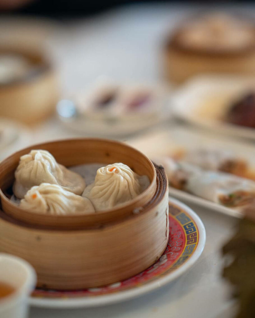 Delicious Xiaolongbao Dumplings Wallpaper with Asian Dining Scenes