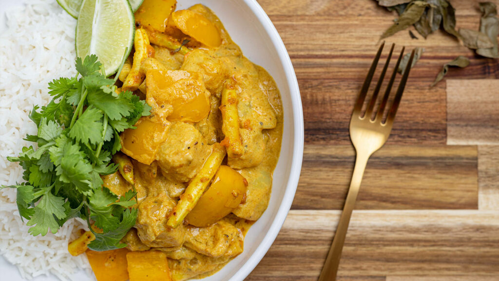 Vibrant Yellow Curry Flat Lay with Rice & Cilantro - Wallpaper Background