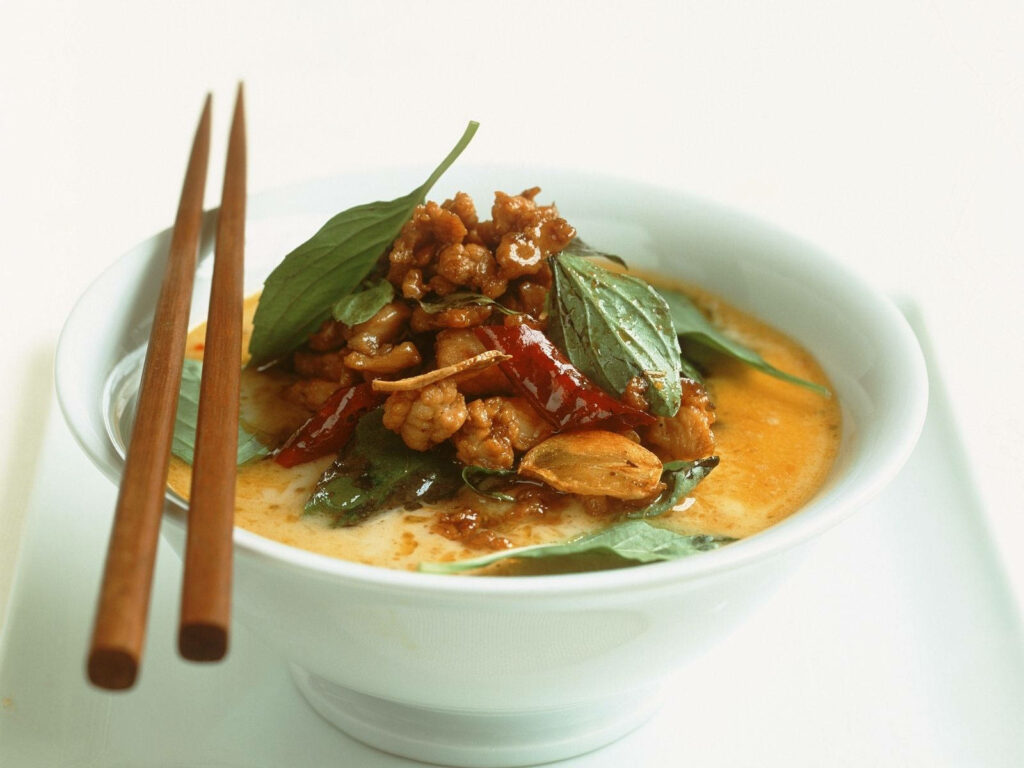 Delicious Yellow Curry Bowl with Fresh Basil & Red Chili - Wallpaper