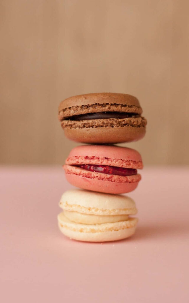 Dreamy Delights: Stacked Macarons in Delectable Desserts Scene Wallpaper in HD 1000x1600 Resolution