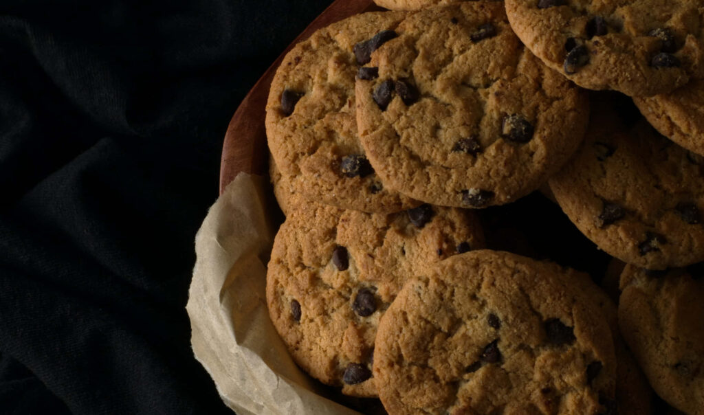 Scrumptious Brown Cookies with Chocolate Chunks on Display Wallpaper