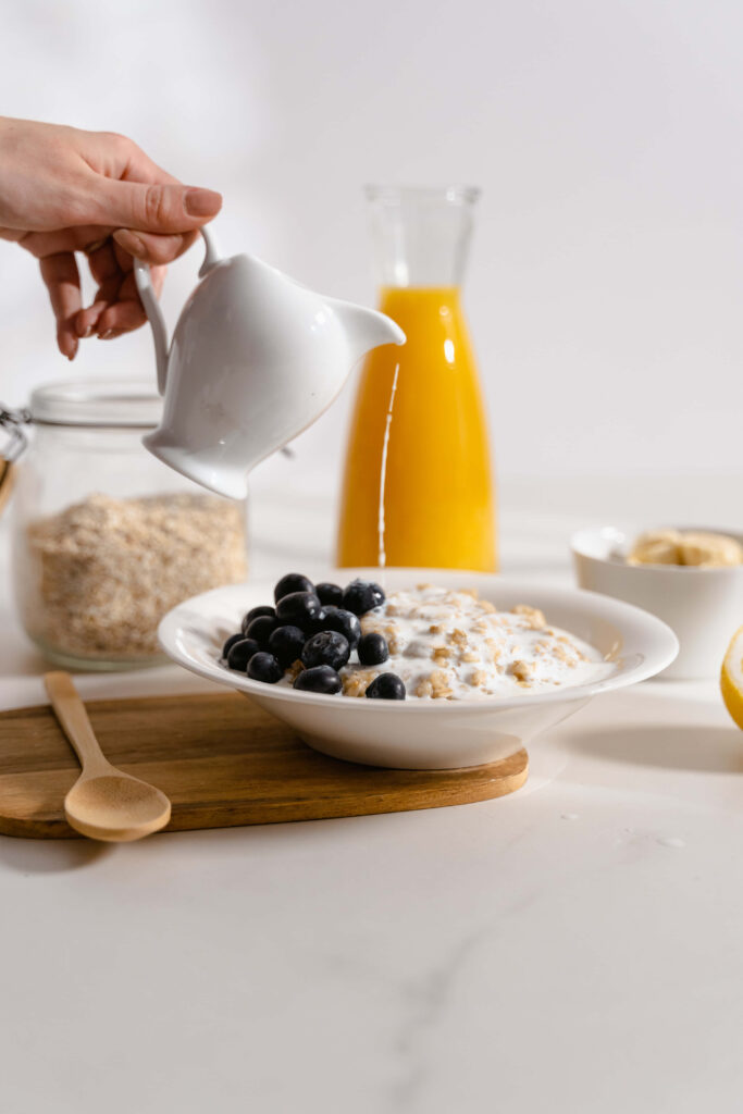 Delightful Breakfast Setup: Cereal, Blueberries, Oats & Fresh Juice Wallpaper