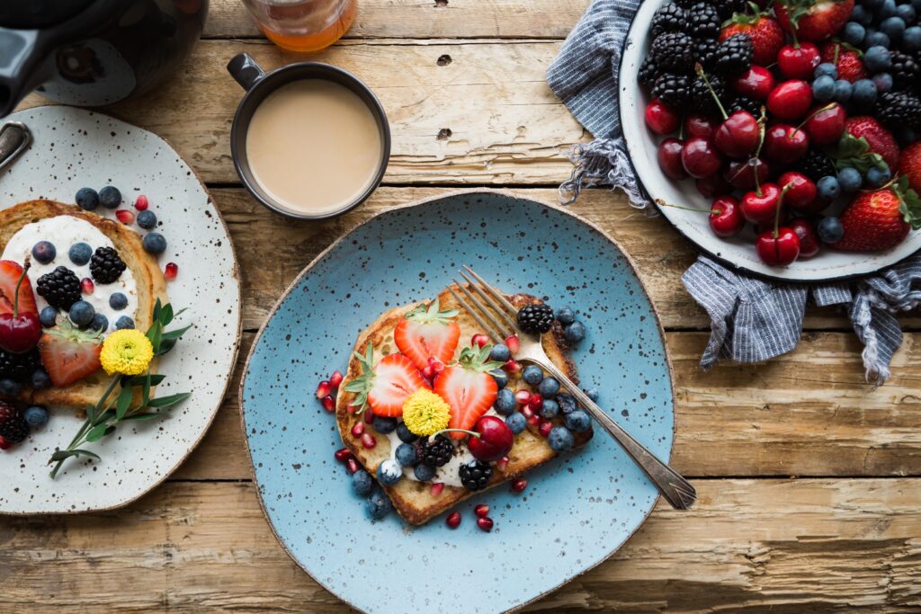 Delightful Breakfast Spread: Toast, Berries, and Coffee Wallpaper