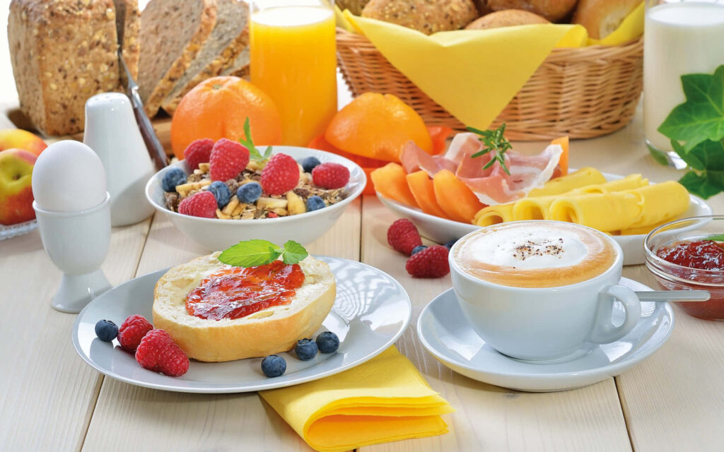 Vibrant Breakfast Spread Wallpaper: Cozy Fruits, Pastries & Coffee