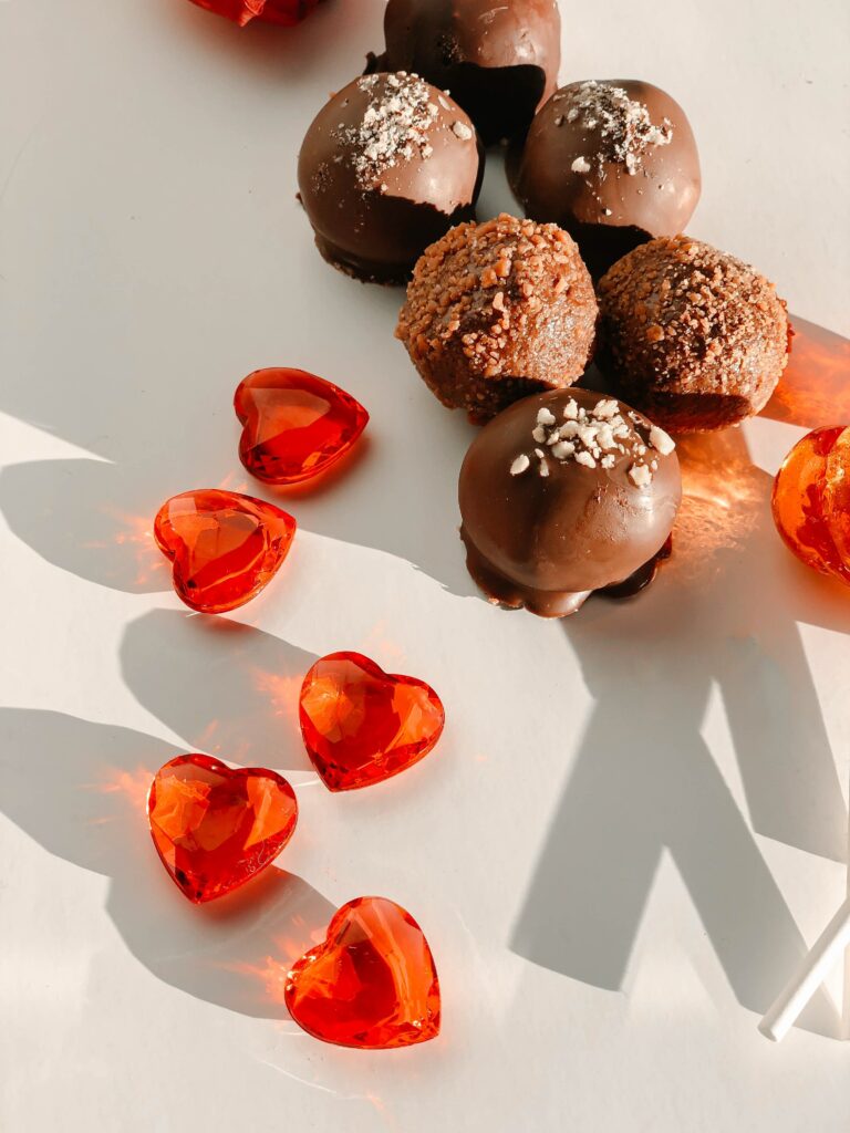 Delightful Chocolate Truffles & Red Heart Decorations Wallpaper