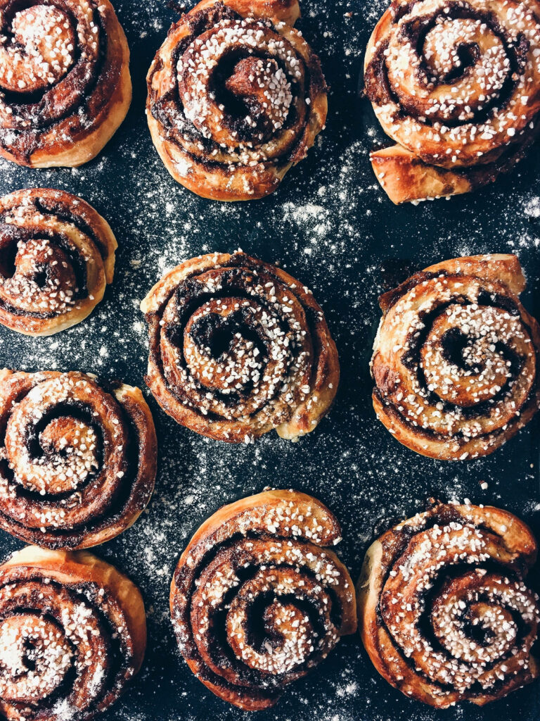 Delightful Cinnamon Rolls Wallpaper: Warm, Sweet & Sugary Background