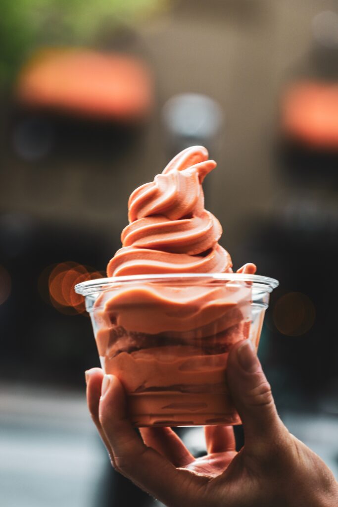Swirled Orange Soft-Serve Ice Cream Close-Up Delightful Wallpaper