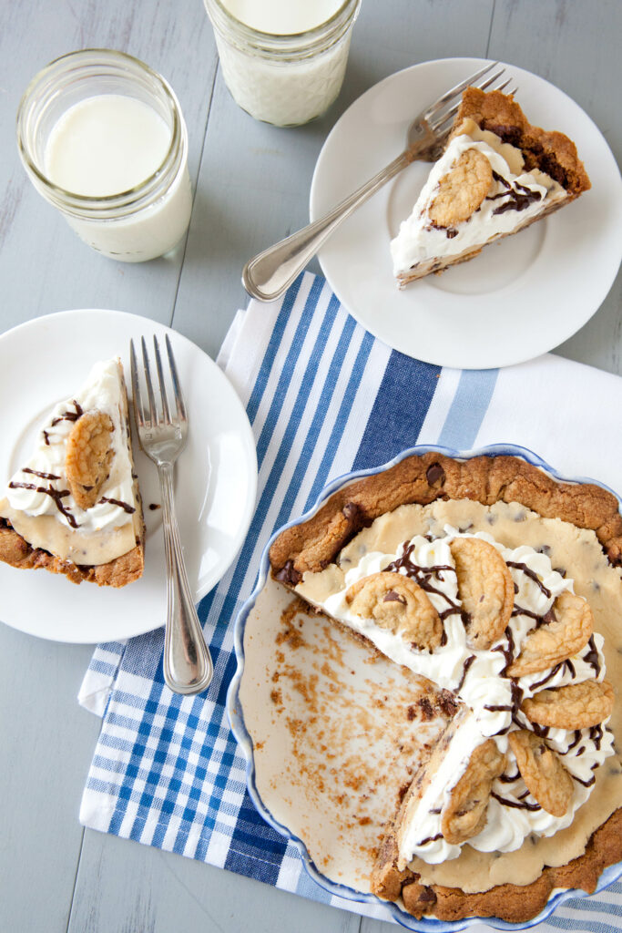 Delightful Dessert Spread: Pie, Pastries & Milk Wallpaper Background