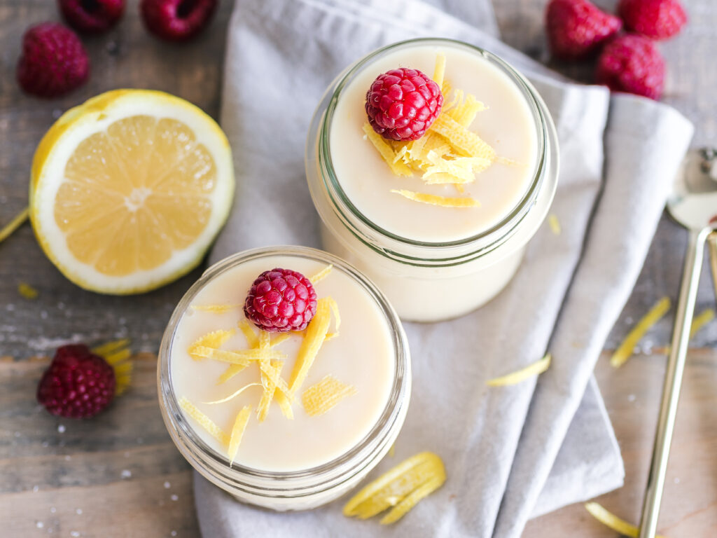 Delightful Dessert Jars Wallpaper with Raspberries & Lemon Zest
