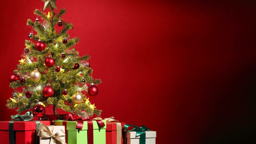 Festive Delight: A Whimsical Christmas Tree Enveloped in Joyful Gifts - Mesmerizing Holiday Wallpaper