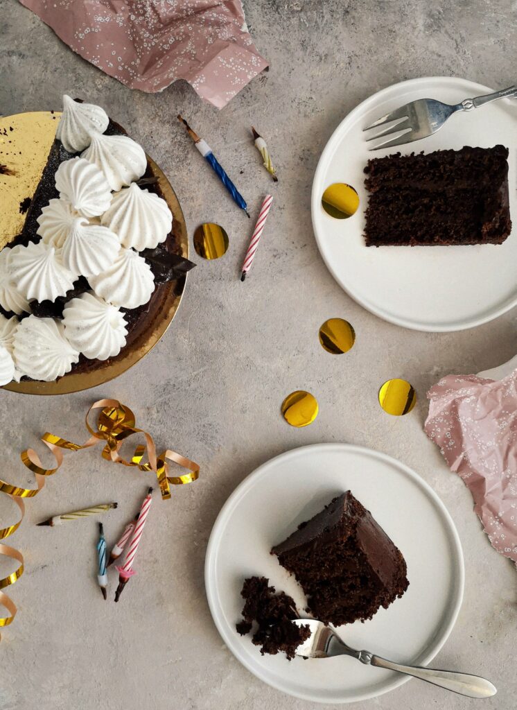 Festive Chocolate Cake Wallpaper with Candles & Holiday Decor