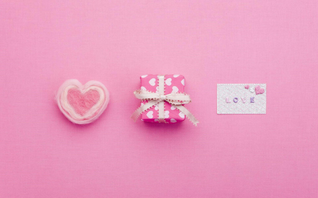 Elegant Pink Delights: Whimsical Hearts, Gifts, and Love Notes Adorning a Linear Pattern Wallpaper
