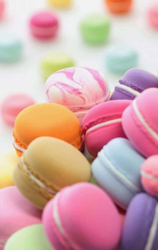 Cheerful Pastel Macarons Wallpaper for a Delightful Background