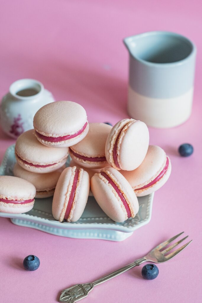 Delightful Pink Macaron Wallpaper with Blueberries & Soft Background