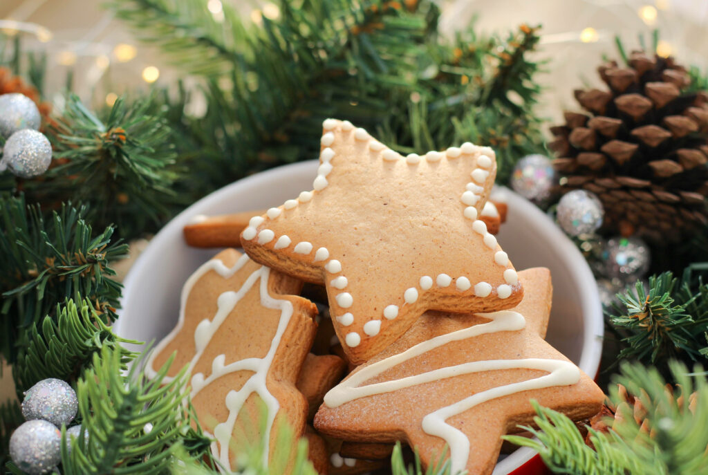 Decadent Gingerbread Stars adorning a Christmas Wonderland Wallpaper