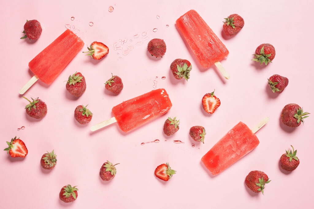 Delightful Strawberry & Fruit Popsicle Wallpaper Background