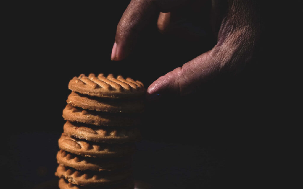 4K Background of Scrumptious Stacked Cookies with Minimalist Composition Wallpaper