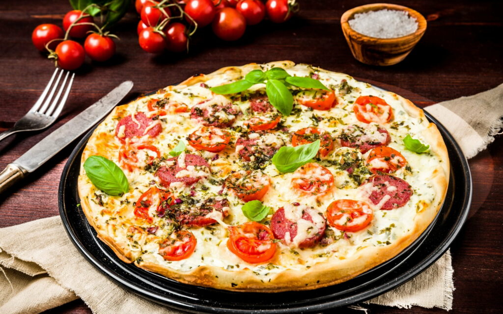 Savor the Delightful Essence of Authentic, Sausage-Topped Italian Pizza – A Scrumptious QHD Wallpaper for Food Connoisseurs