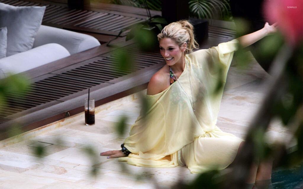 Delta Goodrem poolside in yellow dress tropical background lush greenery summer vibe wallpaper