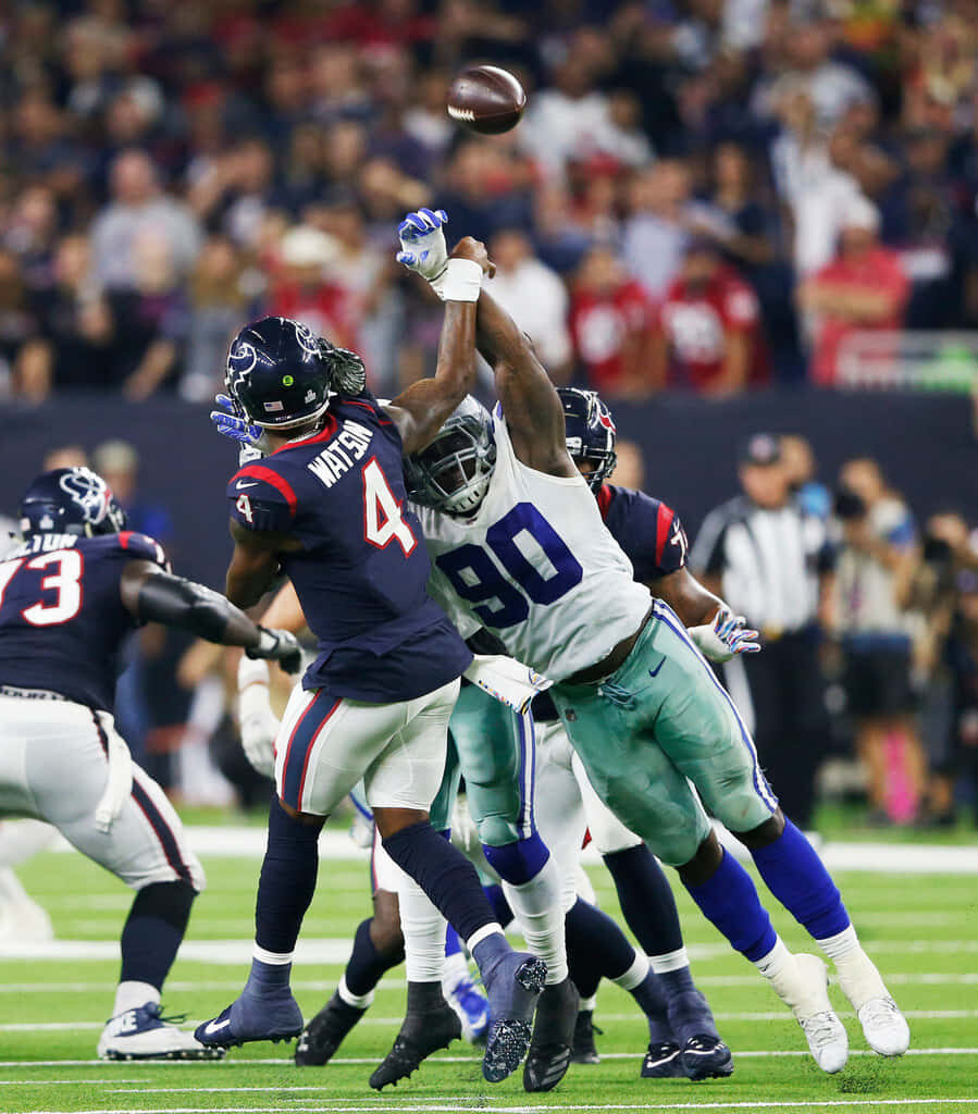 Demarcus Lawrence Action Wallpaper - Intense Game Moment Background