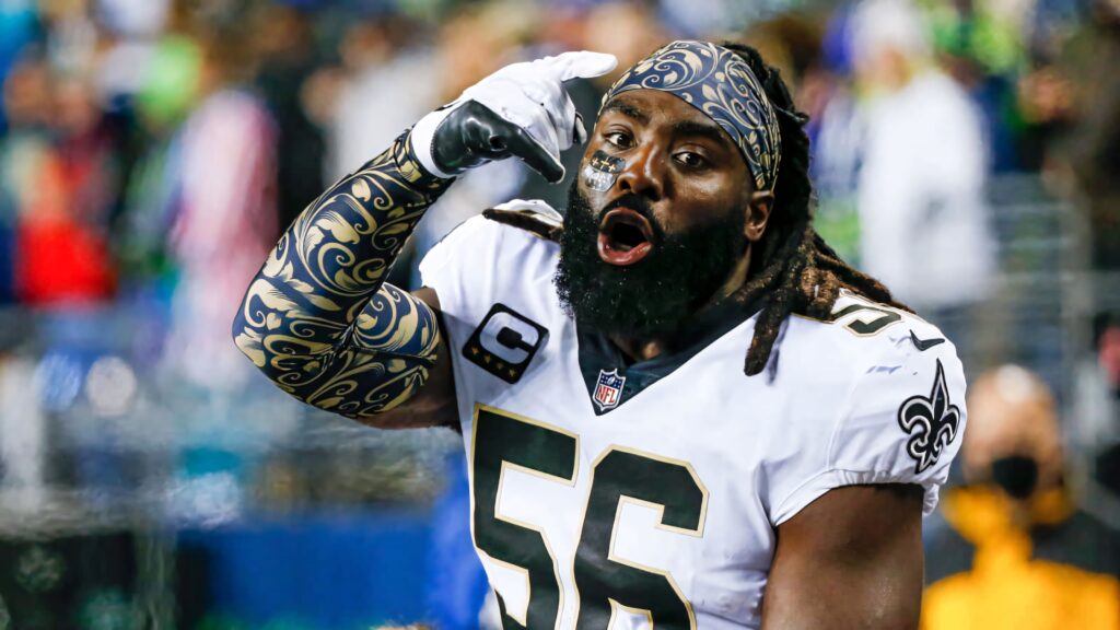 Demario Davis New Orleans Saints celebrating passionately in white jersey on stadium field Wallpaper