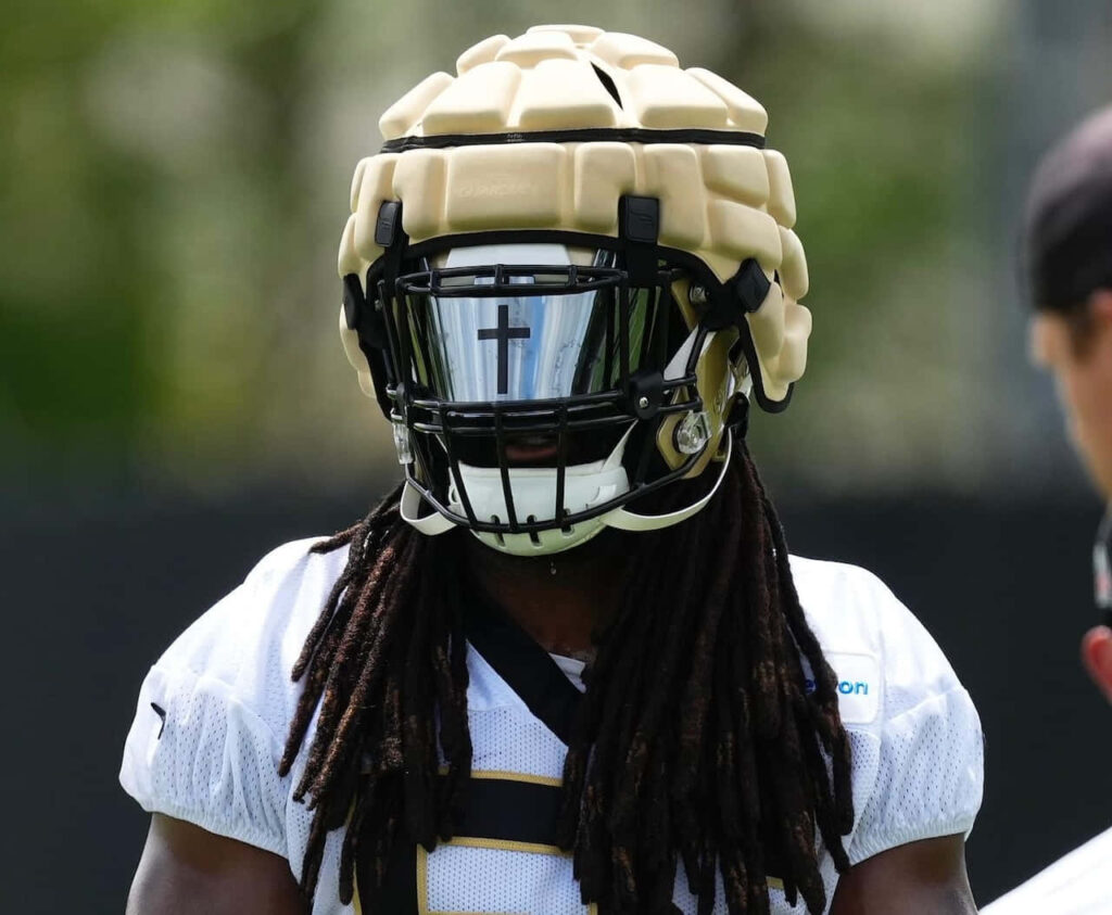 Close-up of football player Demario Davis wearing padded helmet with reflective cross visor wallpaper