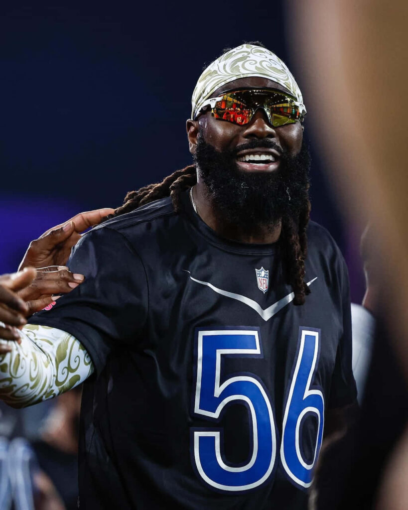 Demario Davis NFL wallpaper smiling in uniform number 56 with reflective visor and headband