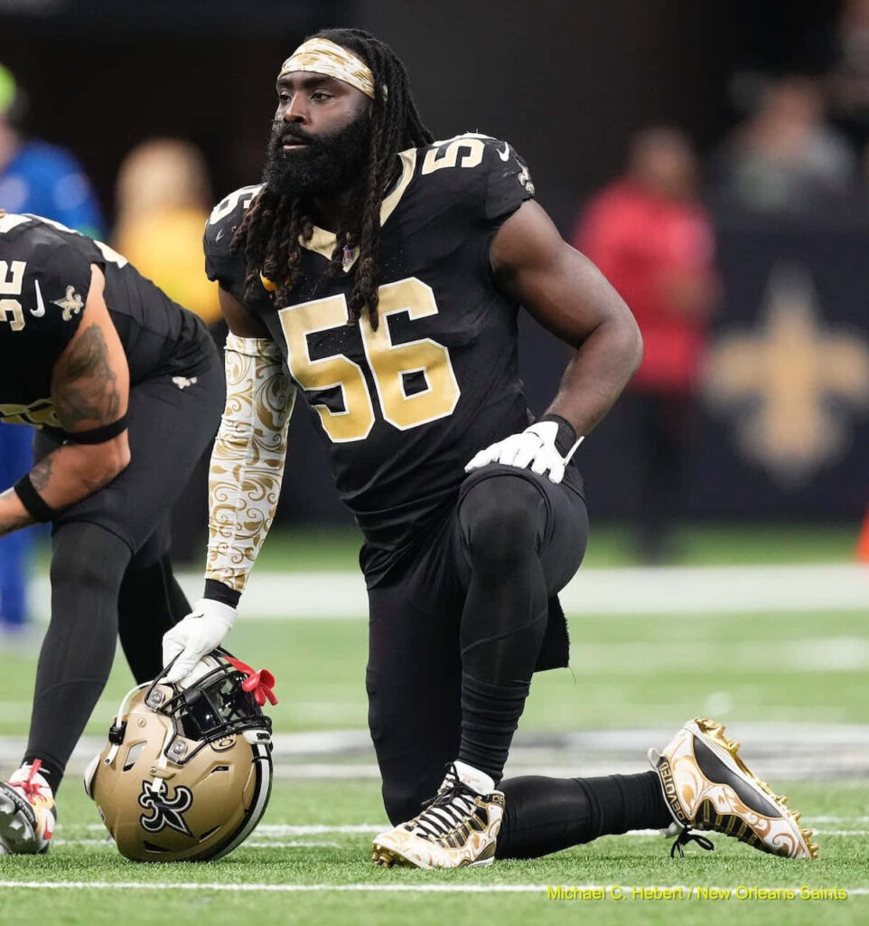 Demario Davis New Orleans Saints linebacker focused in team uniform preparing on stadium turf wallpaper