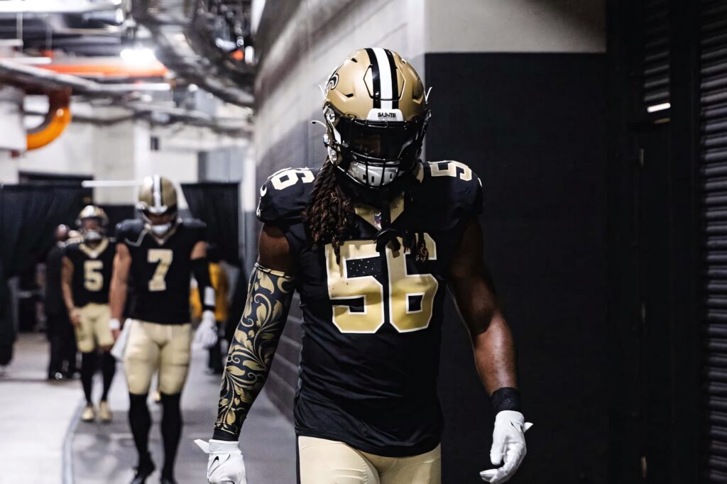 Demario Davis New Orleans Saints number 56 walking focused through stadium tunnel pregame Wallpaper