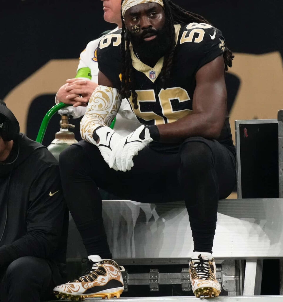 Demario Davis in New Orleans Saints uniform on sideline showing focus and intensity Wallpaper