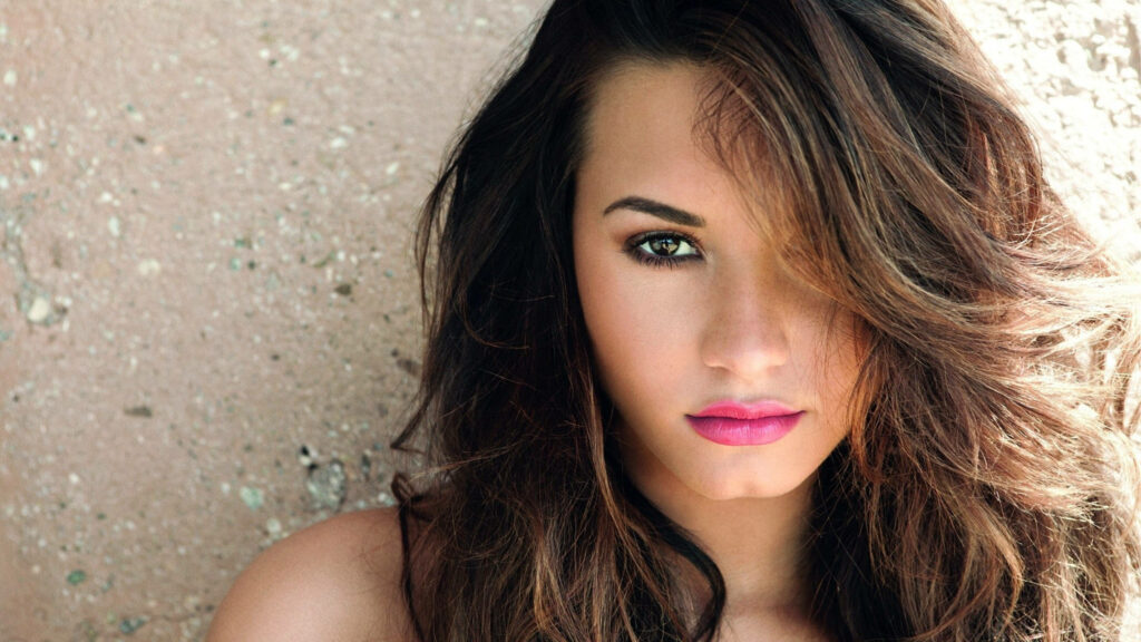 Seductive Demi Lovato Wallpaper: Confident & Striking Background