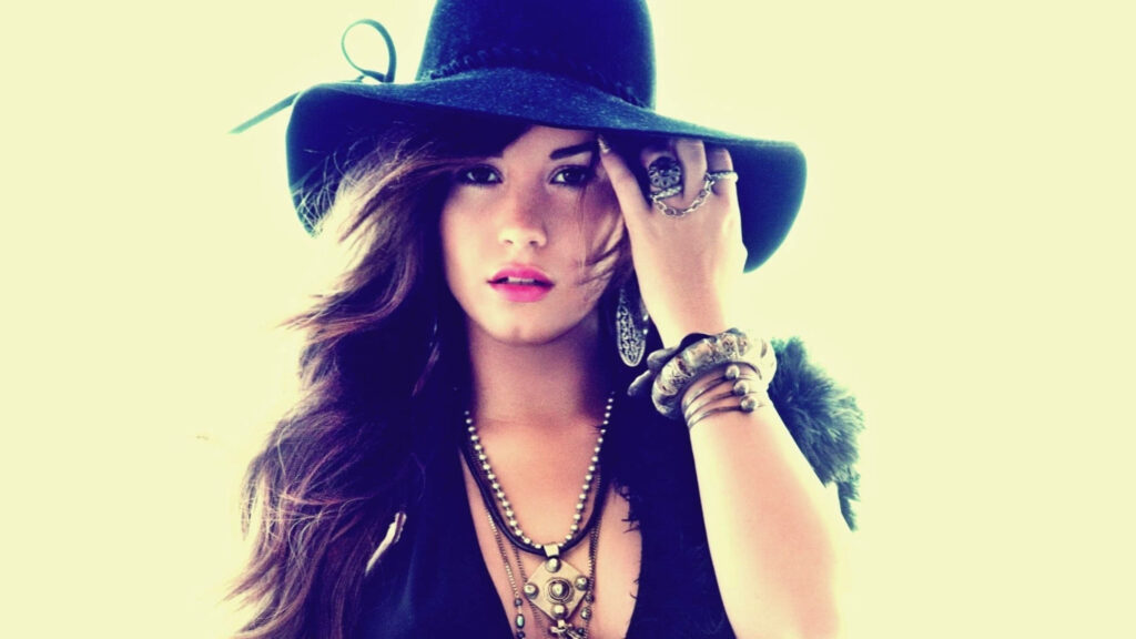 Demi Lovato Wallpaper: Stylish Black Hat & Charismatic Vibe