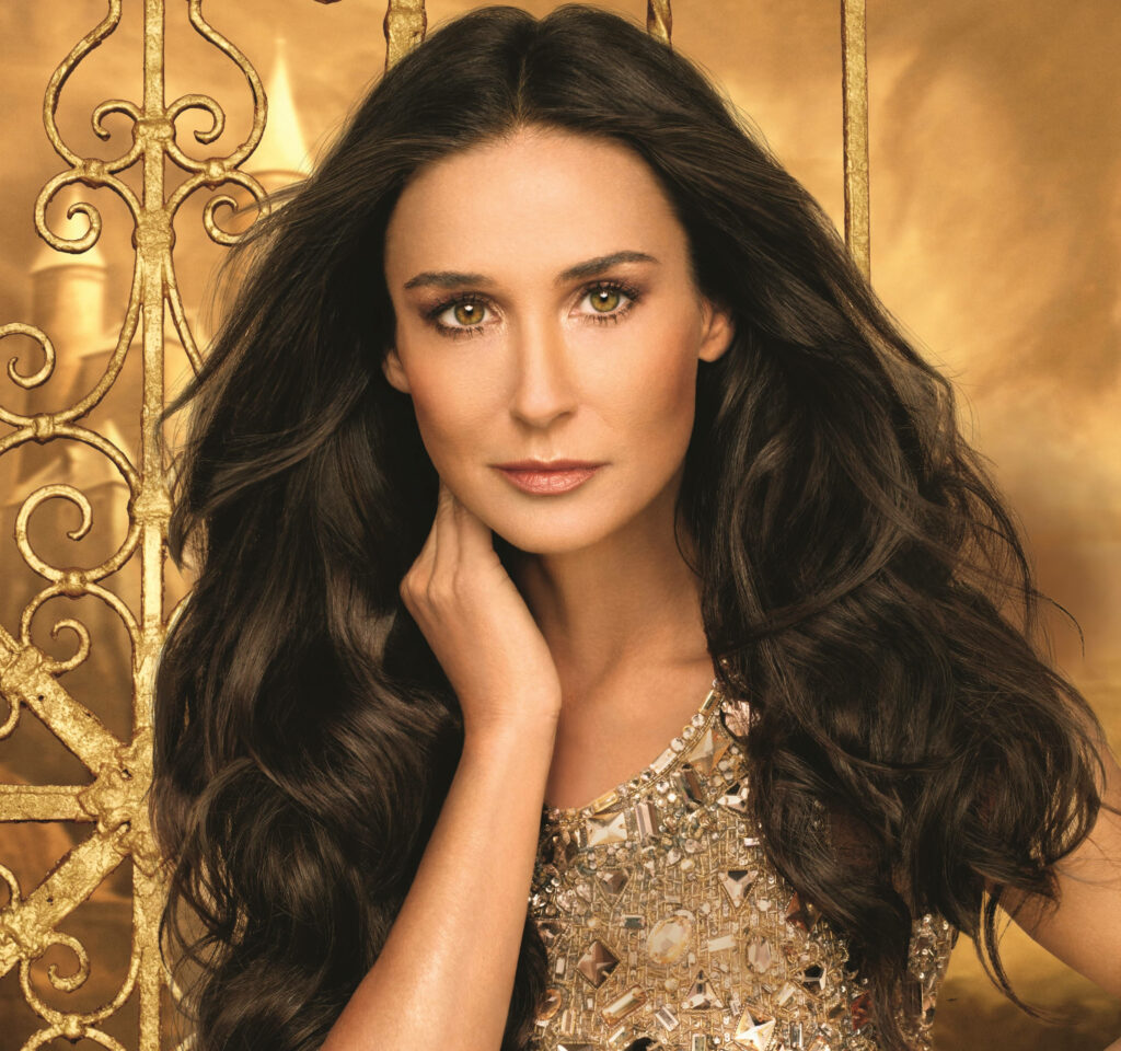 Demi Moore elegant pose golden backdrop long wavy hair sparkling embellished gown glamour wallpaper