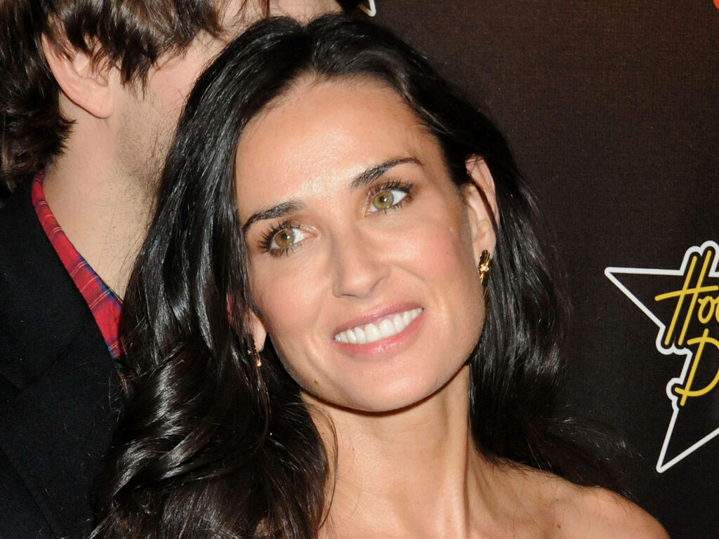 Demi Moore radiant smile dark glossy hair hazel eyes classic Hollywood glamour wallpaper background