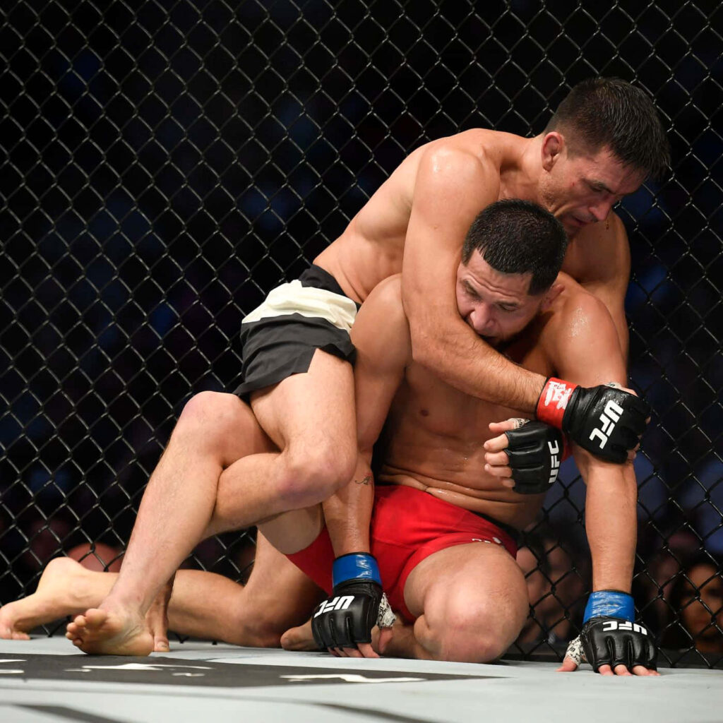Demian Maia controls Jorge Masvidal with tight grappling inside UFC octagon intense MMA fight Wallpaper