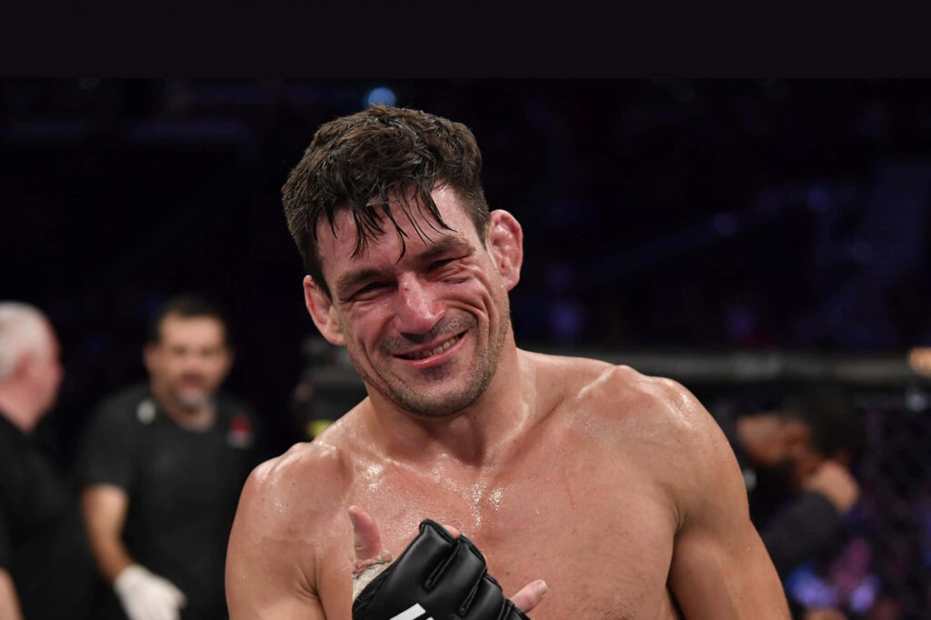 Demian Maia MMA fighter smiling in cage focused athletic build intense fight moment wallpaper