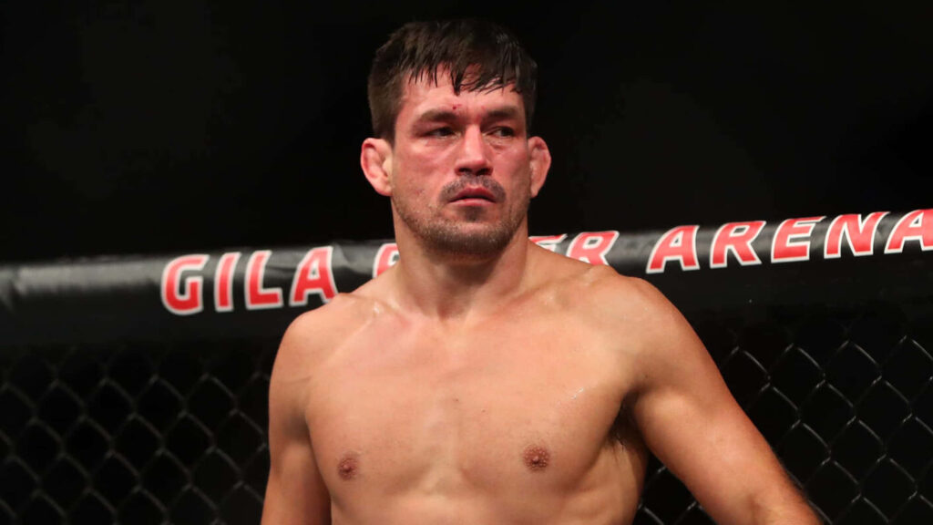 Demian Maia UFC octagon fierce focused MMA fighter intense fight night dramatic lighting Wallpaper
