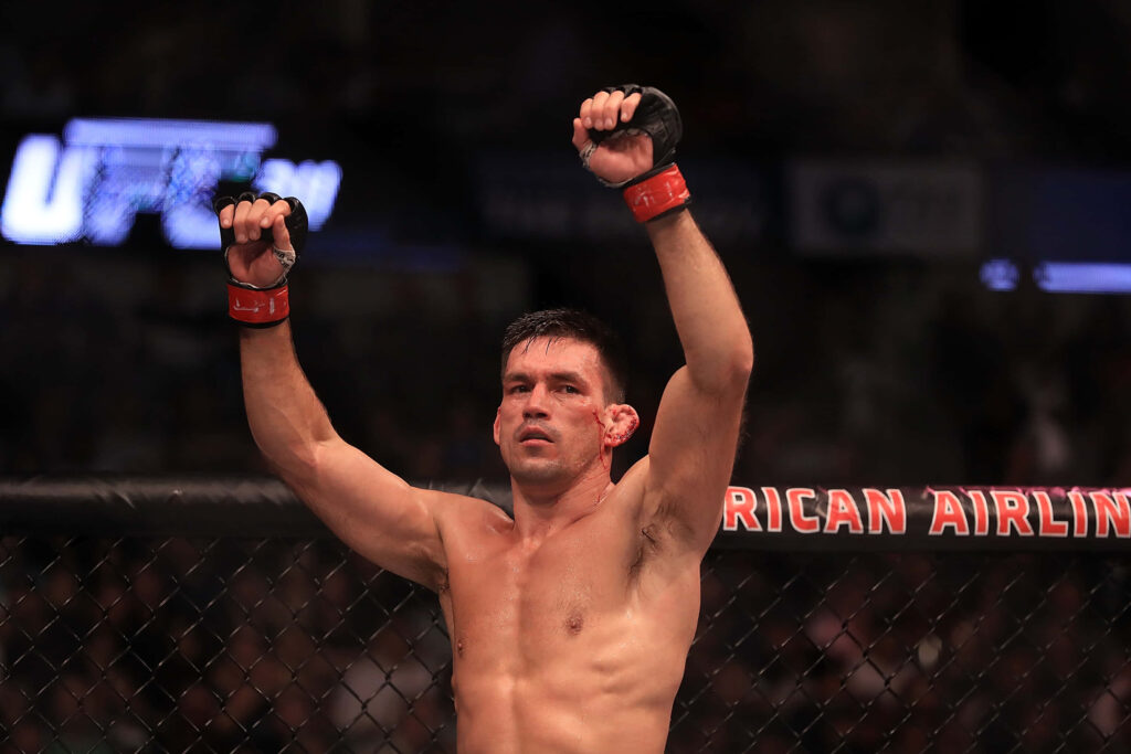 Demian Maia UFC octagon victory fists raised intense expression athletic physique MMA fighter Wallpaper